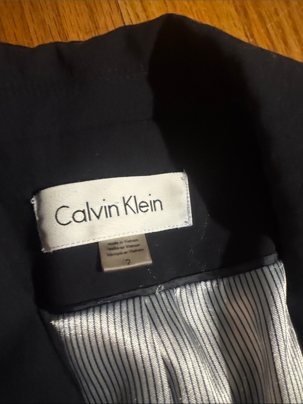 Calvin Klein blazer with Striped Lining!  Excellent like new but missing button